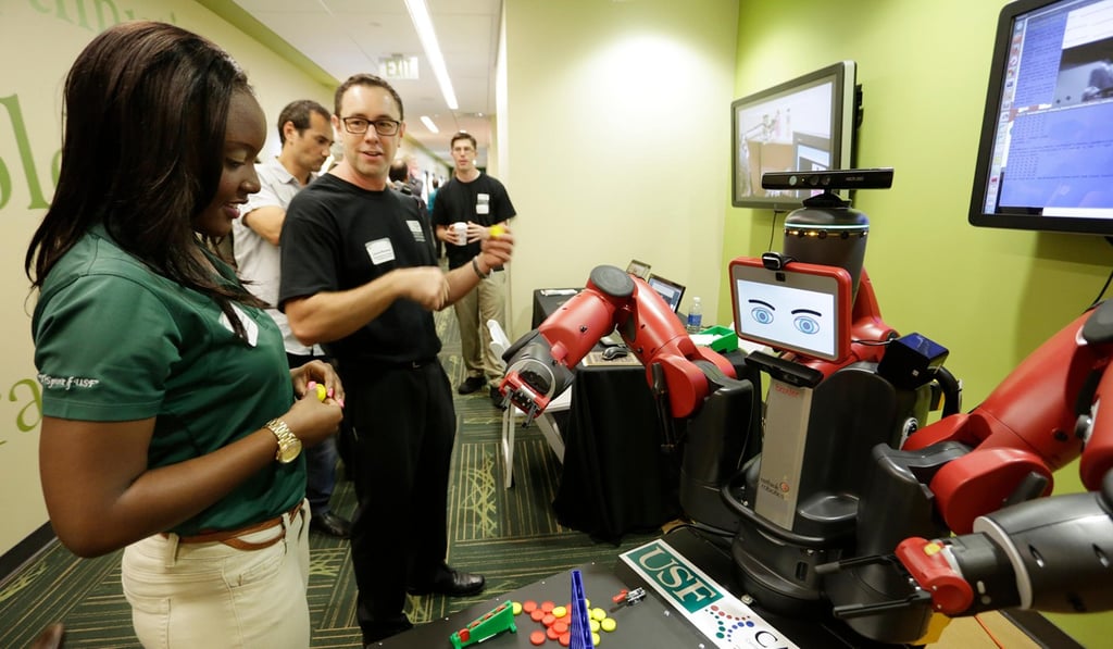 Baxter plays Connect Four in 2014. Photo: James Borchuck/Tampa Bay Times/Zuma Wire