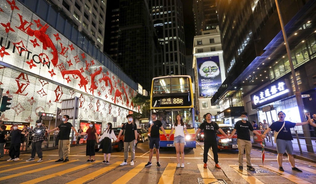 Demonstrators link hands in Central on Friday. Photo: Dickson Lee