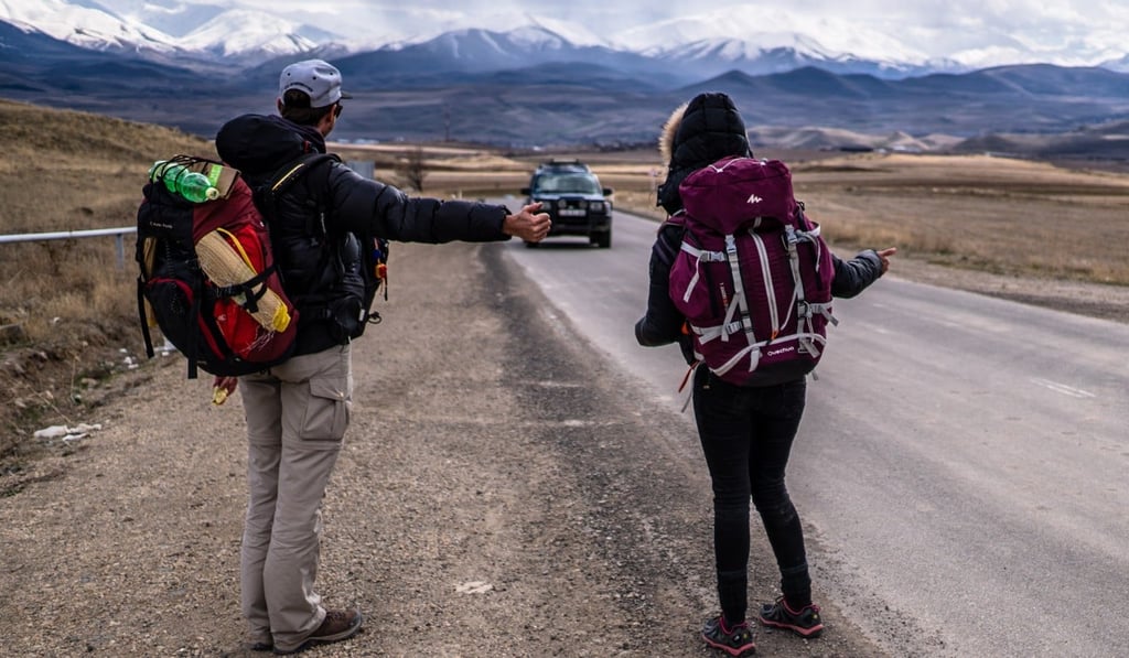 The French couple hitchhiking in wintry Armenia in March, 2018.