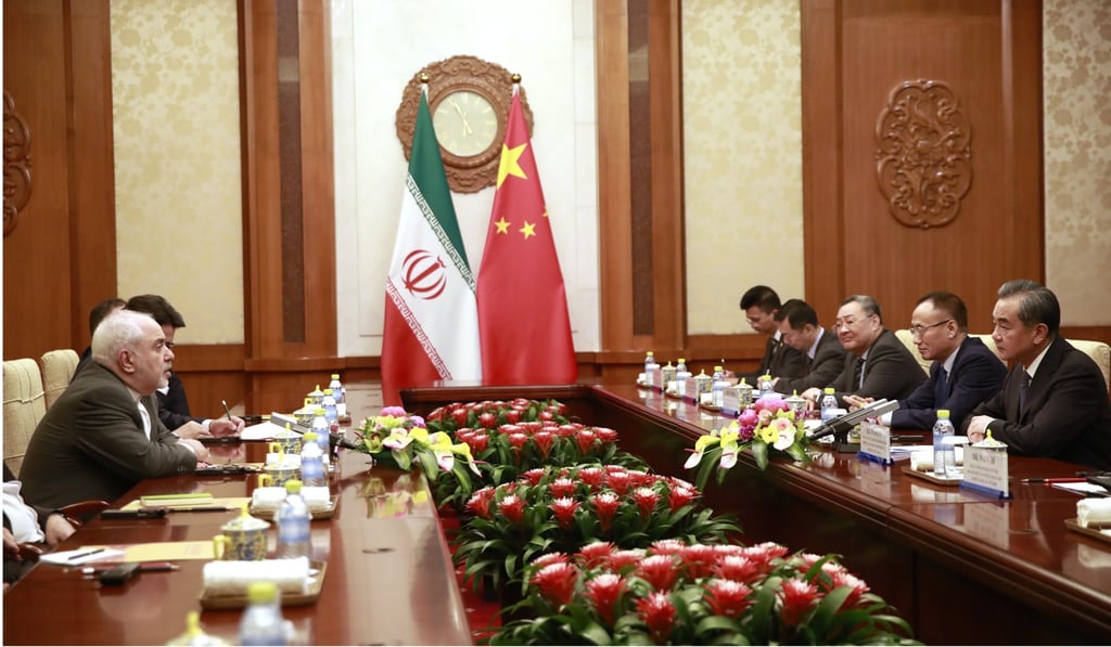 Mohammad Javad Zarif (left) speaks with Wang Yi (right) during the meeting. Photo: AFP Mohammad Javad Zarif (left) speaks with Wang Yi (right) during the meeting. Photo: AFP
