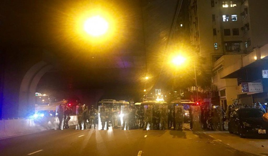 Riot police hold the line 200m from the liaison office during a protest on August 4. Photo: SCMP
