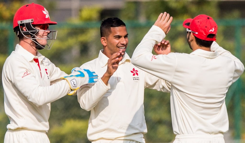 Nadeem Ahmed (centre) celebrates with teammates after taking a wicket. Photo: CHK