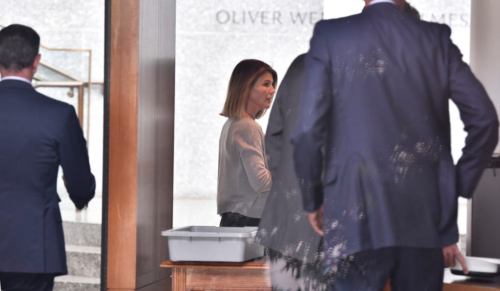 Actress Lori Loughlin, and her husband, the fashion designer Mossimo Giannulli, arrive at the federal courthouse in Boston. Photo: Reuters