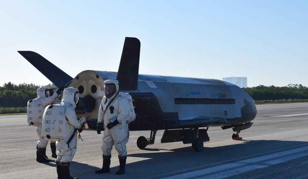 Personnel attend to the unmanned US Air Force X-37B. Photo: US Air Force Personnel attend to the unmanned US Air Force X-37B. Photo: US Air Force
