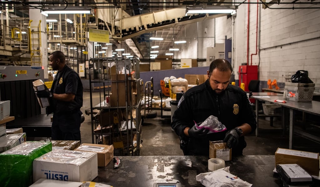Customs officials check items of mail for illegal drugs at John F. Kennedy International Airport in New York. Photo: Washington Post