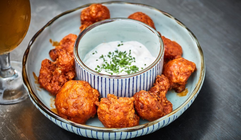 Komune’s buffalo cauliflower with blue cheese dip is bold and delicious.