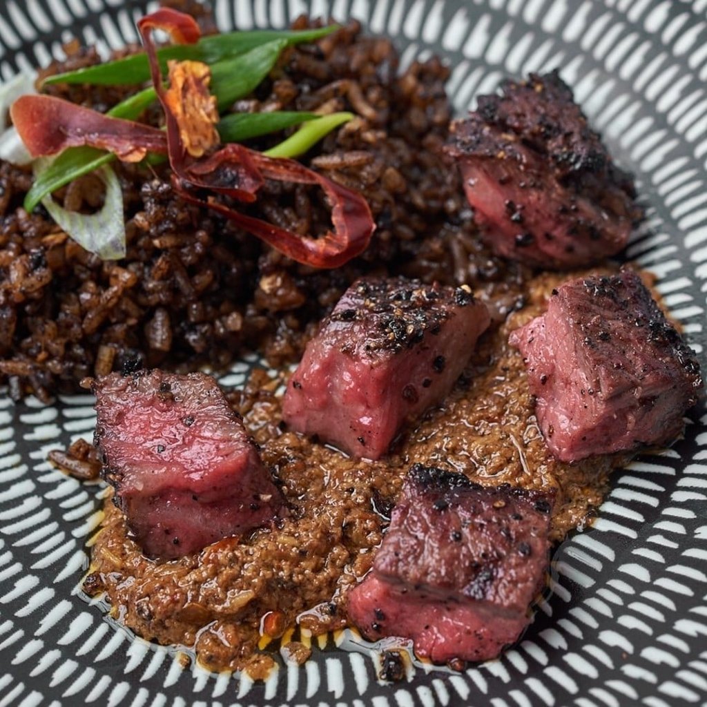 US Mishima wagyu rib-eye with heirloom rendang and buah keluak fried rice at modern Singaporean restaurant The Quarters.
