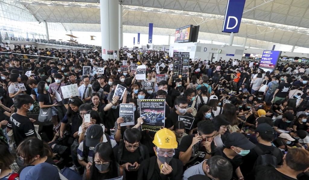 Hong Kong airport was brought to a standstill on August 12 as thousands of protesters prevented passengers from reaching the departure gates. Photo: Felix Wong