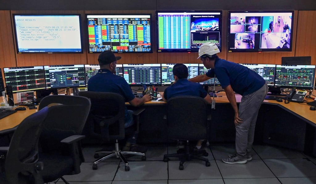 Technicians monitoring operations in the control room of the underground cooling system installation of the Marina Bay Sands hotel and resort in Singapore. Photo: AFP