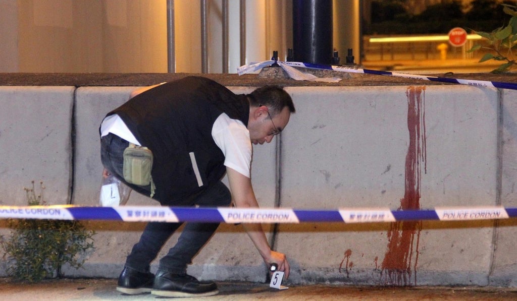 Police investigate the scene where an off-duty officer was attacked on Friday night at Kwai Fung MTR station. Photo: Handout
