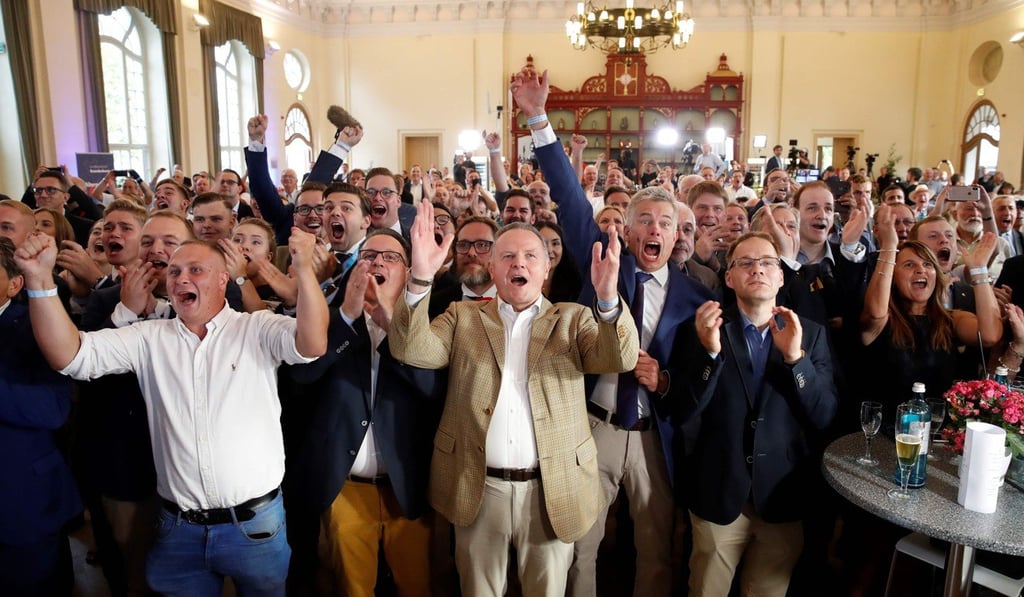 Members and supporters of the Alternative for Germany react after the first exit polls on Sunday in Werder an der Havel near Potsdam. Photo: AFP Members and supporters of the Alternative for Germany react after the first exit polls on Sunday in Werder an der Havel near Potsdam. Photo: AFP