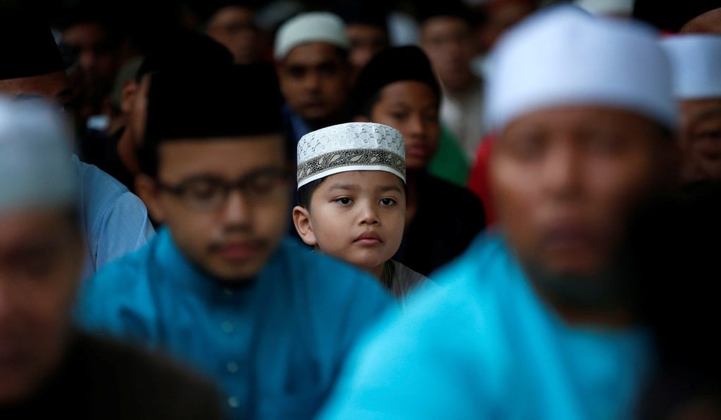 Muslims attend Eid al-Fitr prayers to mark the end of the holy fasting month of Ramadan at Al-Mukminin Mosque in Singapore in 2017. Photo: Reuters