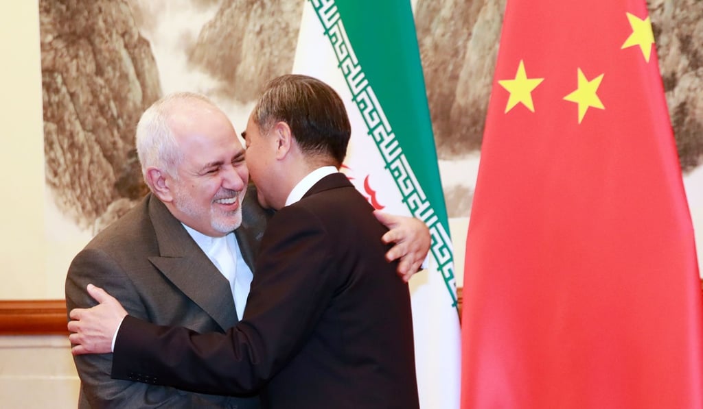 Chinese Foreign Minister Wang Yi (right) shakes hands with his Iranian counterpart Mohammad Javad Zarif in Beijing last month. Photo: AFP