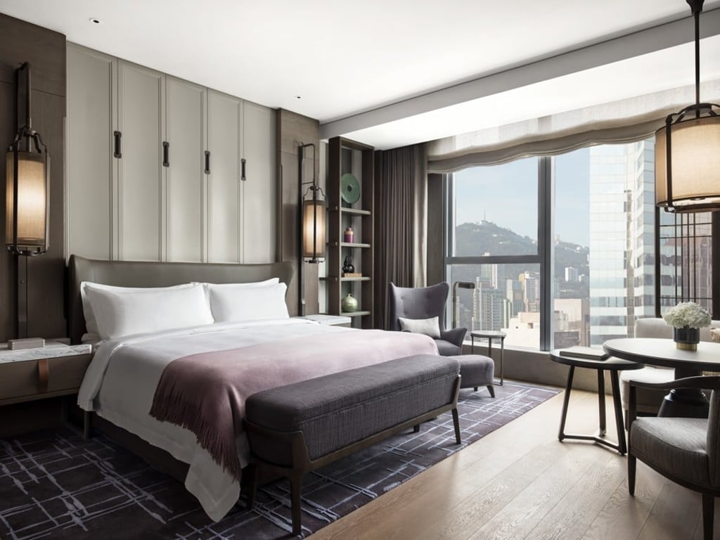 At The St. Regis Hong Kong, the Grand Deluxe room features both city and partial harbour views. At The St. Regis Hong Kong, the Grand Deluxe room features both city and partial harbour views.