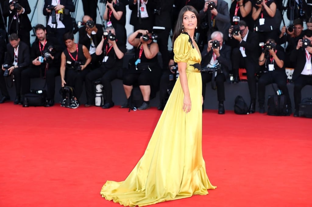 Italian actress Alessandra Mastronardi in a yellow Gucci gown poses on the red carpet. Photo: Zhang Cheng/Xinhua Italian actress Alessandra Mastronardi in a yellow Gucci gown poses on the red carpet. Photo: Zhang Cheng/Xinhua