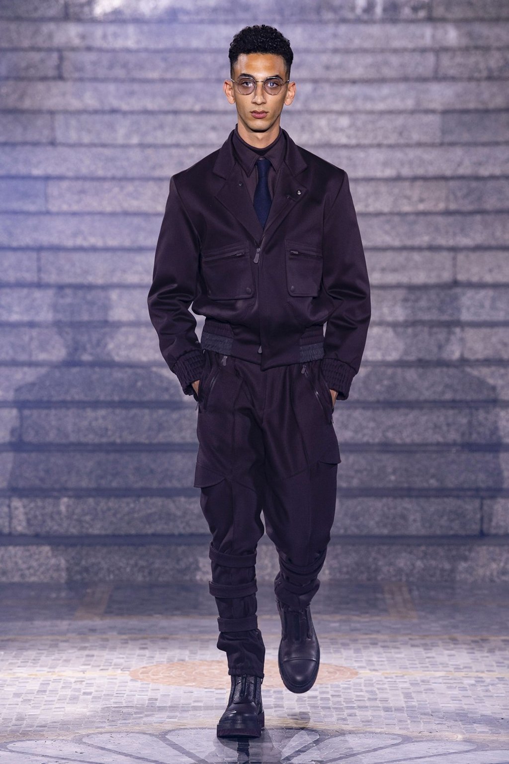 A model presents a pair of stylish large-pocketed cargo trousers – part of designer Alessandro Sartori’s vision of a contemporary metropolitan wardrobe’ from the Ermenegildo Zegna fall/winter 2019 collection show.