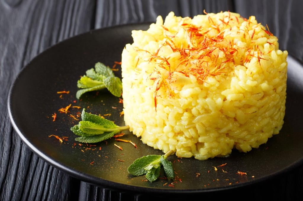 Traditional risotto is coloured golden thanks to the addition of saffron Traditional risotto is coloured golden thanks to the addition of saffron