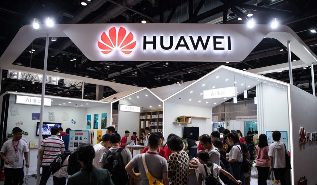 Attendees visit a Huawei exhibition stand during the Consumer Electronics Expo in Beijing. Photo: AFP