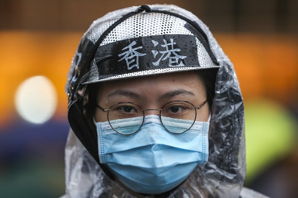 Anti-extradition bill protesters march from Victoria Park in Causeway Bay towards Central after they attended a rally against police brutality at the Victoria Park. Protesters often wear face masks to hide their identities from CCTV cameras.