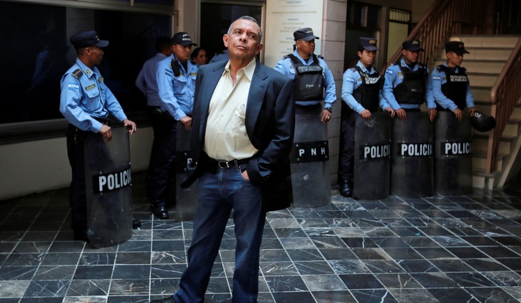 Porfirio Lobo, Honduras' former president, waits outside court for his wife in August. Photo: Reuters
