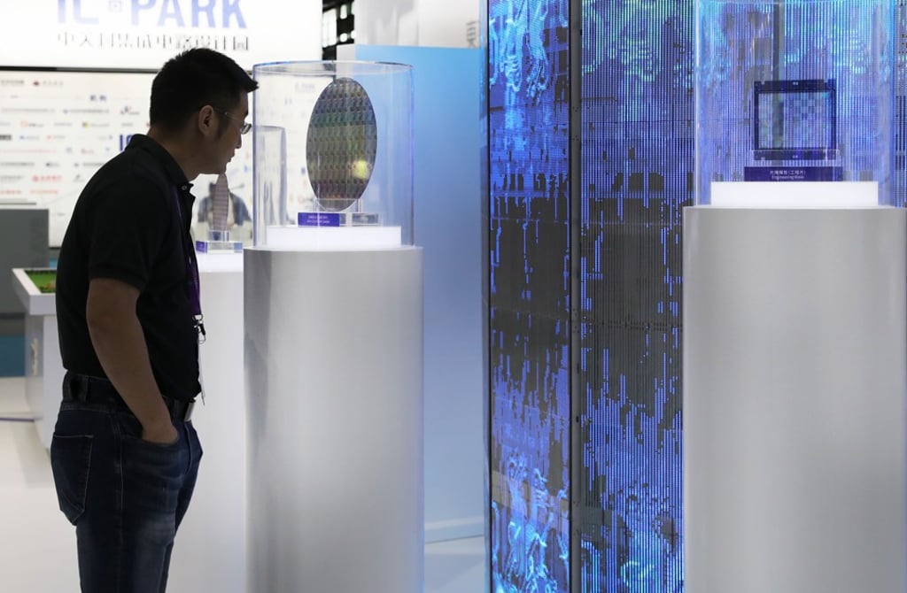 A visitor views a semiconductor wafer on exhibit at the 17th China International Semiconductor Expo in Shanghai on September 3. EDA software enables users to keep up with designing more powerful chips, as these silicon-based devices get smaller. Photo: Xinhua A visitor views a semiconductor wafer on exhibit at the 17th China International Semiconductor Expo in Shanghai on September 3. EDA software enables users to keep up with designing more powerful chips, as these silicon-based devices get smaller. Photo: Xinhua