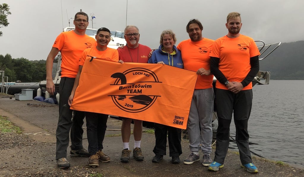 Mak, his teammates and their support team after completing the relay.