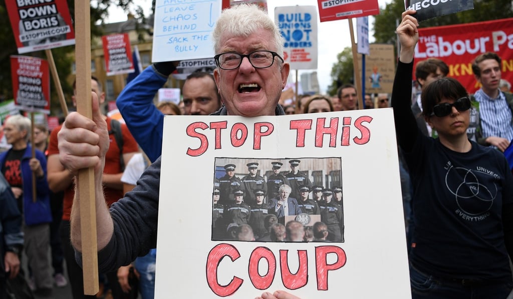 Protesters in London on Saturday call on British Prime Minister Boris Johnson to resign. Photo: EPA-EFE