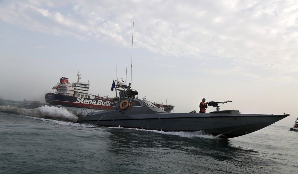 An Iranian Revolutionary Guard speedboat moves around a British-flagged oil tanker, the Stena Impero, in the Iranian port of Bandar Abbas in July. Photo: Mizan News Agency via AP
