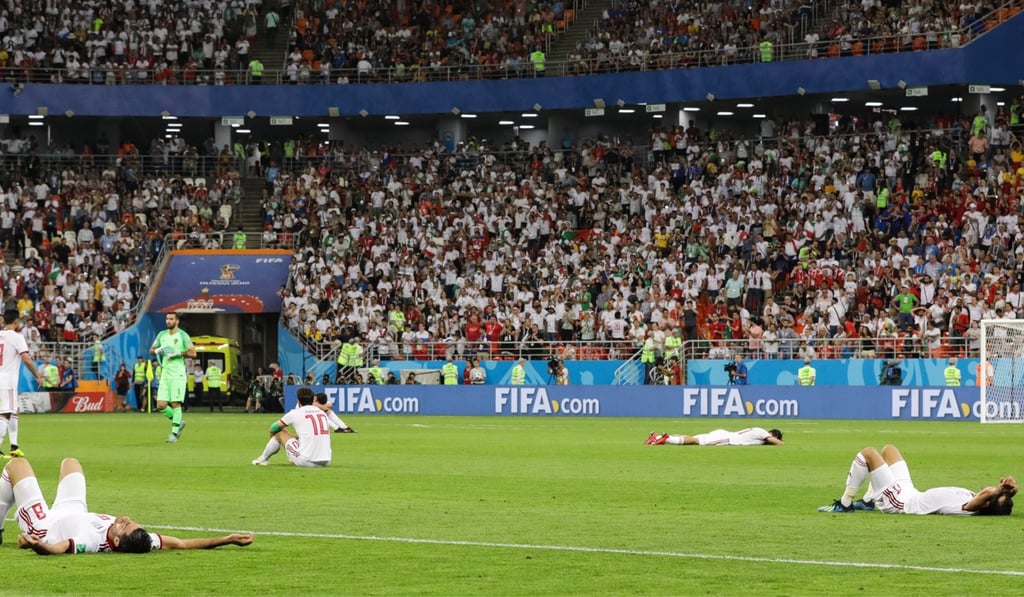 Iran players react after going out of the 2018 World Cup in Russia after a draw with Portugal. Photo: EPA