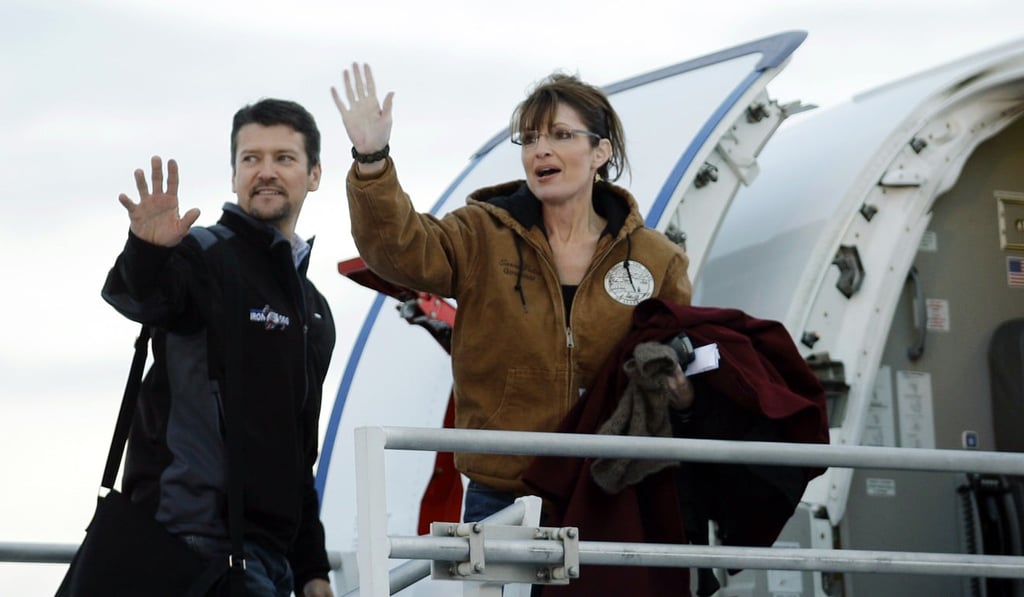 Sarah Palin and her husband Todd wave as they leave the Ted Stevens Anchorage International Airport in Anchorage, Alaska, in November 2008. Photo: AP Sarah Palin and her husband Todd wave as they leave the Ted Stevens Anchorage International Airport in Anchorage, Alaska, in November 2008. Photo: AP