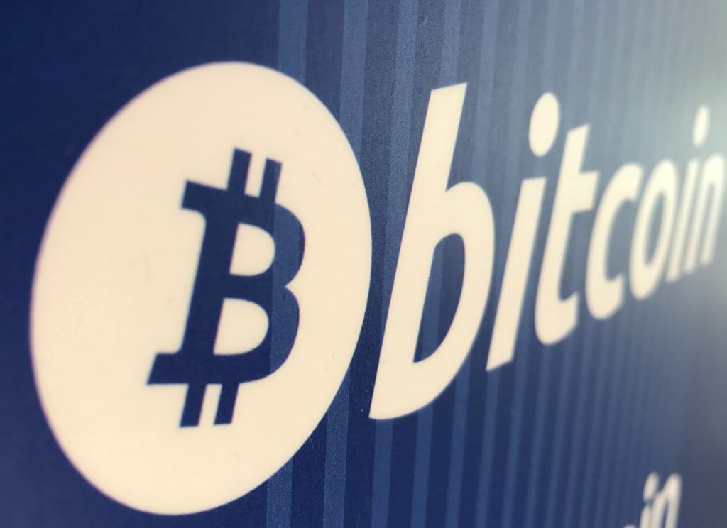 A bitcoin logo is visible on a cryptocurrency ATM in Santa Monica, California. Photo: Reuters