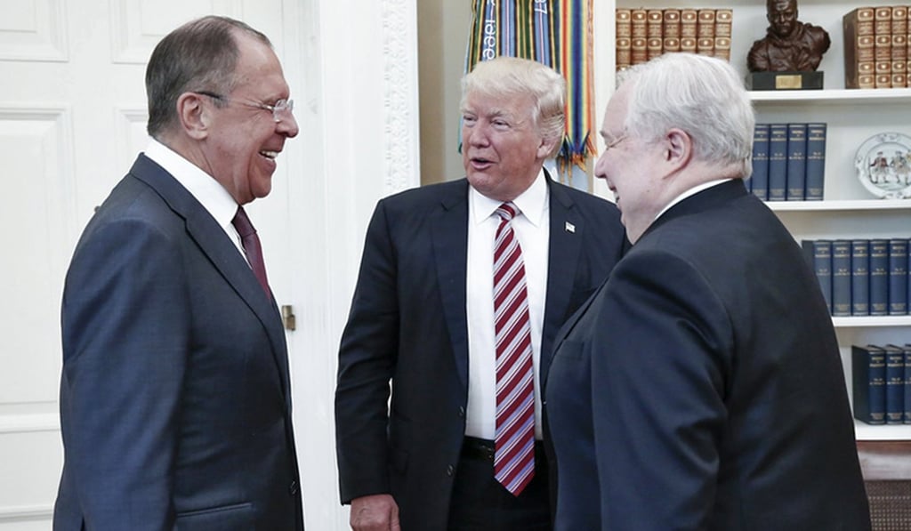 US President Donald Trump (centre) speaks with Russian Foreign Minister Sergei Lavrov (left) and Russian ambassador Sergei Kislyak at the White House in May 2017. Photo: Russian Foreign Ministry via EPA