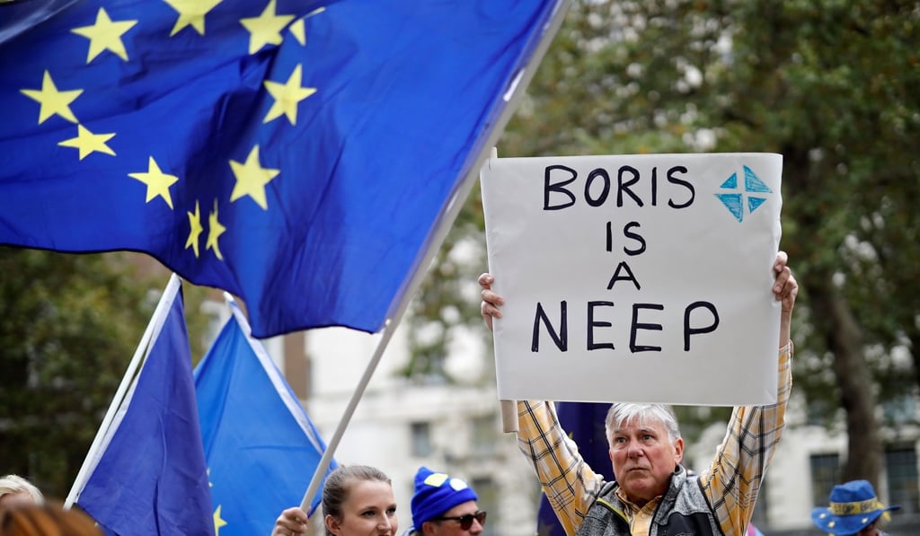 Protesters gather near Downing Street in central London on Tuesday. Photo: AFP Protesters gather near Downing Street in central London on Tuesday. Photo: AFP