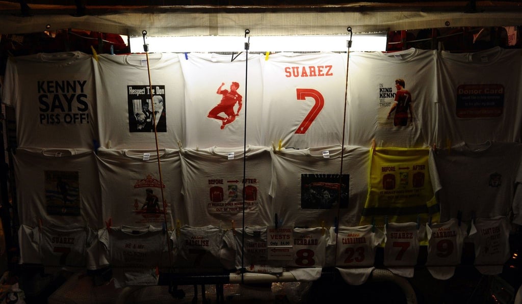 A stall selling merchandise supporting Liverpool’s Uruguayan forward Luis Suarez is seen outside Anfield in 2011. Photo: AFP
