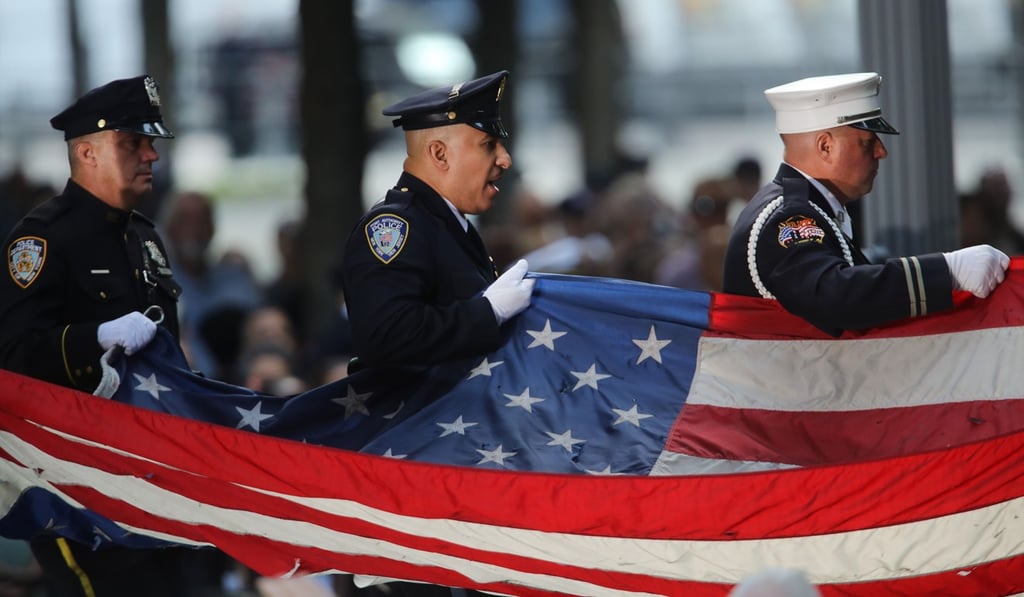 Firefighters and police participate in the start of ceremonies at the National September 11 Memorial in New York City. Photo: AFP