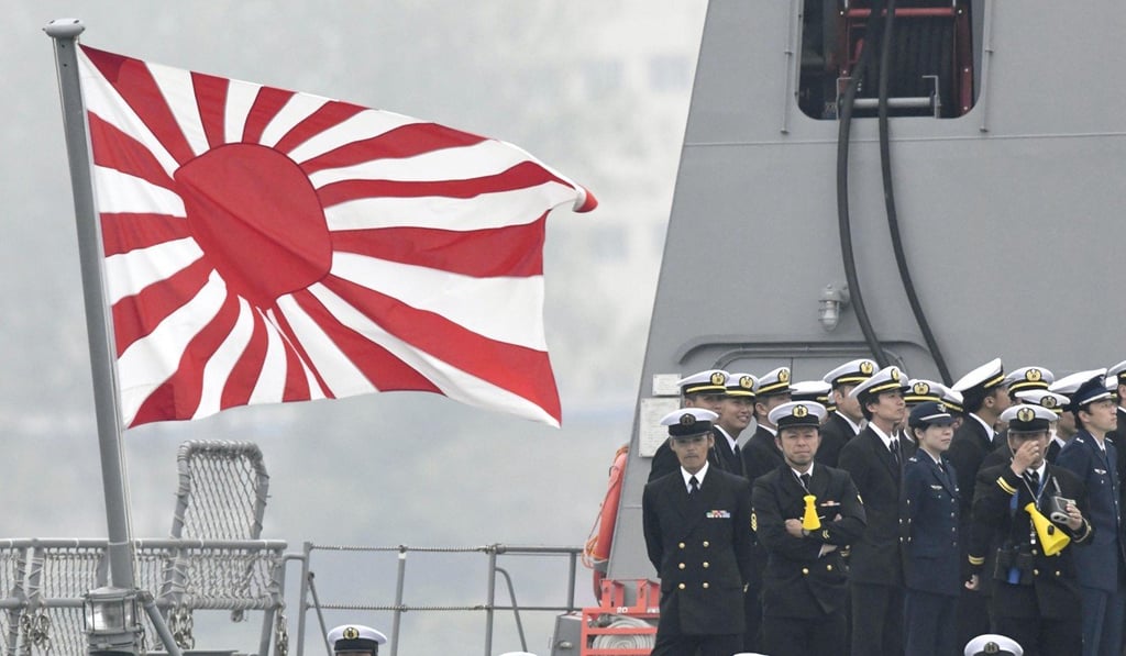 A Japanese Maritime Self-Defense Force ensign on the deck of the destroyer Suzutsuki. Photo: Kyodo