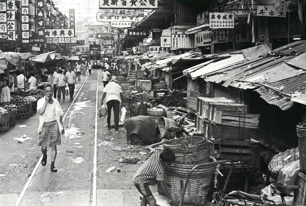 A tram pushes through a market on Chun Yeung Street in North Point in August 1969. Photo: Benson Lo