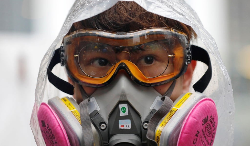 Hong Kong protesters refer to their gas masks as “snouts” and regard each other as sau zuk, which means “hands and feet”, a Cantonese idiom to refer to how close they are. Photo: Reuters