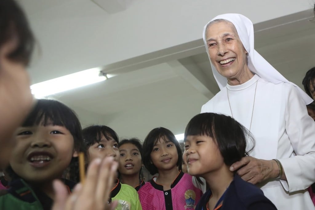 Sister Ana Rosa Sivori with pupils from St Mary’s School. Photo: AP