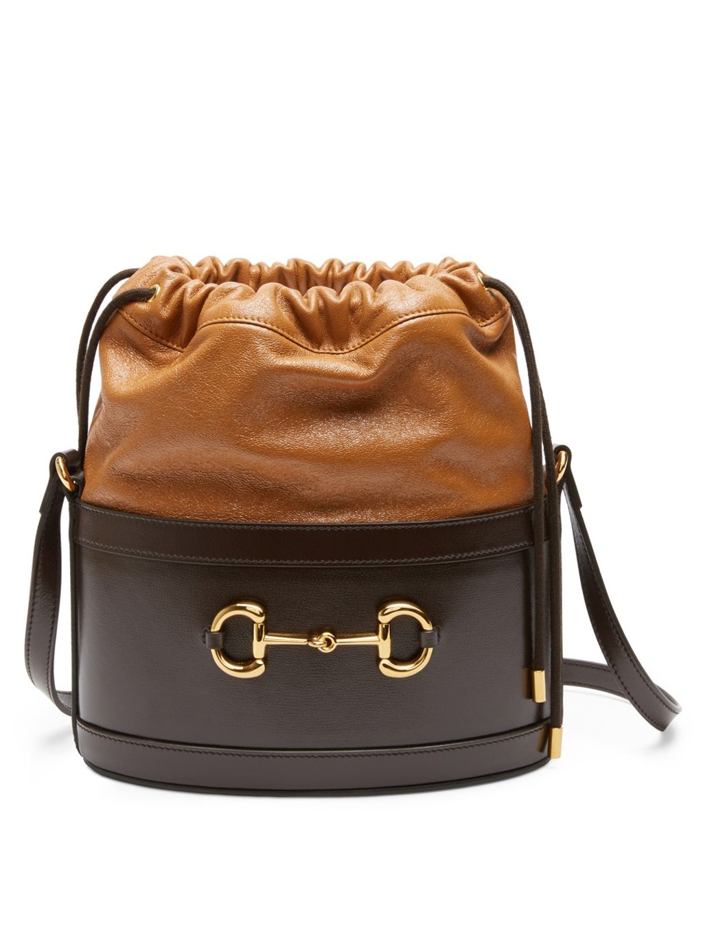 The Gucci 1955 Horsebit differs from typical bucket bag designs, with a constructed circular base and soft leather nearer to the drawstring. The Gucci 1955 Horsebit differs from typical bucket bag designs, with a constructed circular base and soft leather nearer to the drawstring.