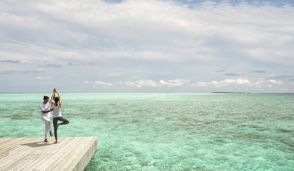 Yoga classes with resident yogis are among the wellness treatments and experiences offered at The Spa and Ayurvedic Retreat at Four Seasons Resort Maldives Landaa Giraavaru. Photo: Four Seasons Resort Maldives Landaa Giraavaru