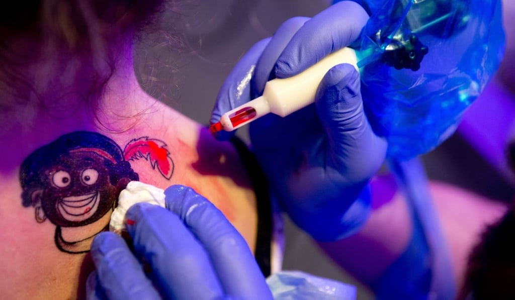 A woman has a Black Pete tattooed on her back in Rotterdam in 2013. Photo: AFP