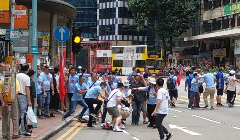 Government supporters and protesters clash outside Fortress Hill MTR station. Photo: Handout.