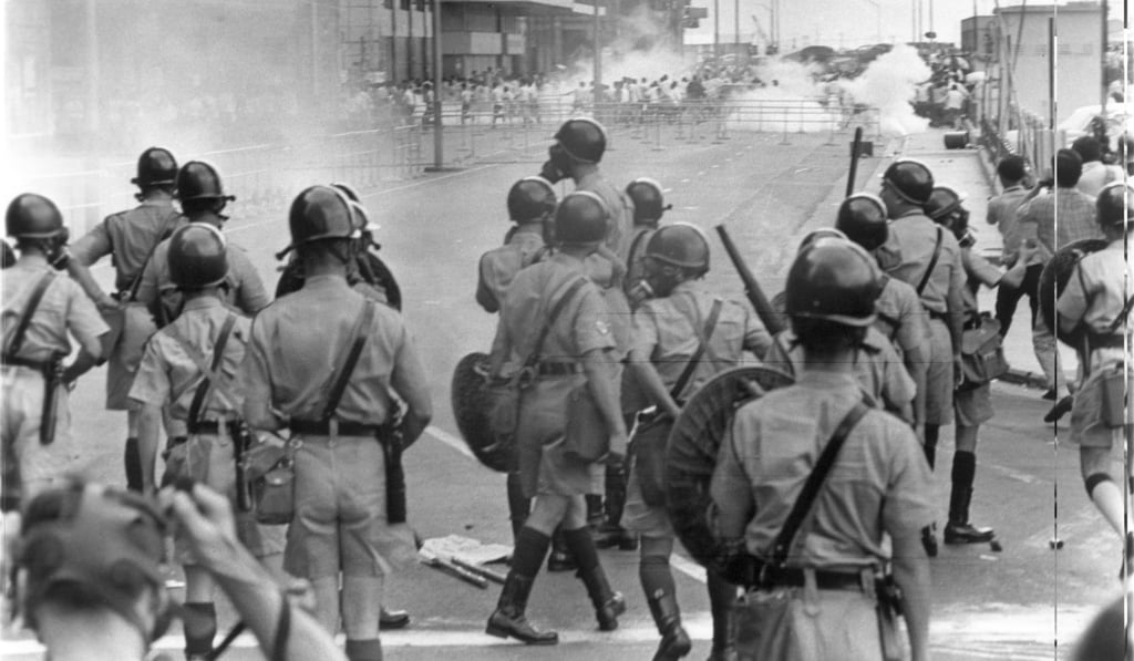 Riot police fire tear gas to disperse crowds in Central in May 1967. The pro-communist riots of May to December 1967 shook Hong Kong and led to a loss of confidence in the city. Photo: SCMP Pictures