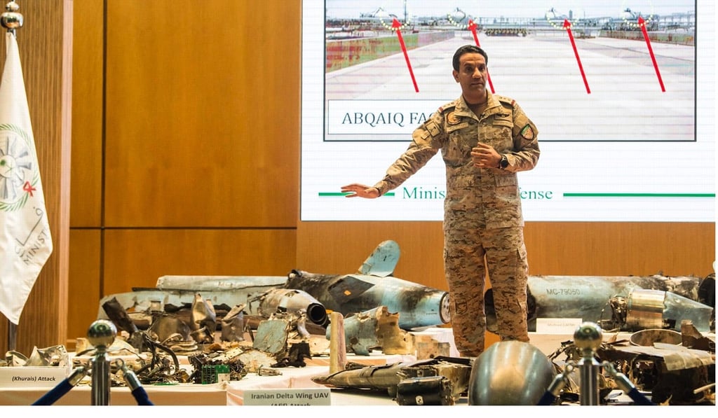 Saudi Defence Ministry spokesman Colonel Turki al-Malki with the remains of missiles allegedly used in the attack against Aramco oil facility. Photo: DPA
