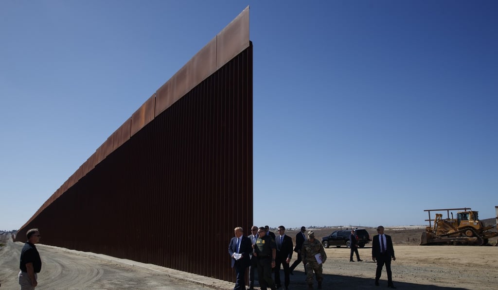 US President Donald Trump tours a section of the southern border wall. Photo: AP