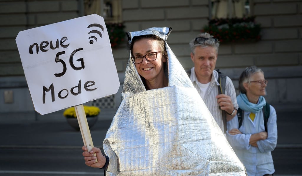 A woman takes part in a national demonstration against 5G technology outside the Swiss Parliament in Bern. Photo: AFP A woman takes part in a national demonstration against 5G technology outside the Swiss Parliament in Bern. Photo: AFP