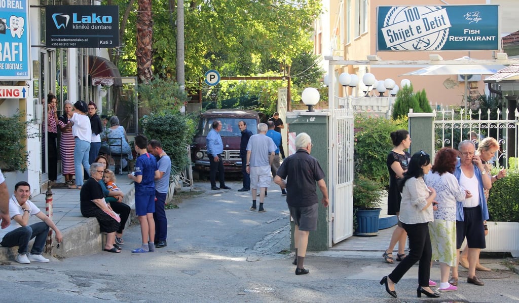 Locals stand outside their apartments after a 5.8 magnitude earthquake hit in Tirana. Photo: EPA-EFE
