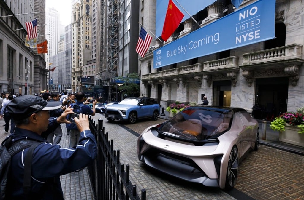Electric vehicles lined up in front of the New York Stock Exchange (NYSE) leading up to the initial public offering of NIO, a Chinese electric-vehicle company, in New York on 12 September 2018. Photo: EPA-EFE