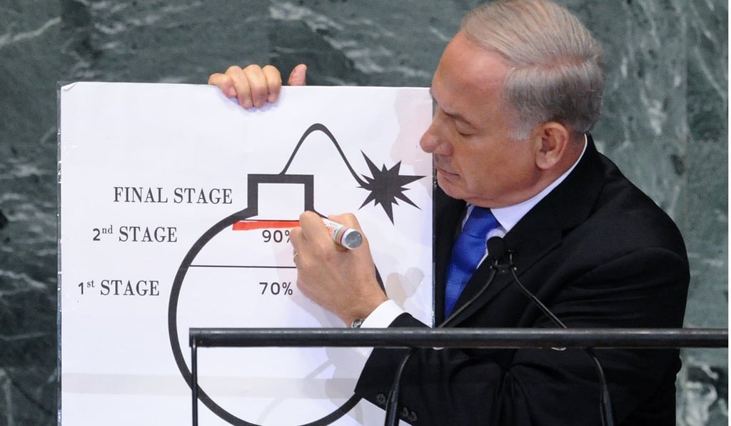 Israeli Prime Minister Benjamin Netanyahu draws a red line on a bomb. File photo: Xinhua